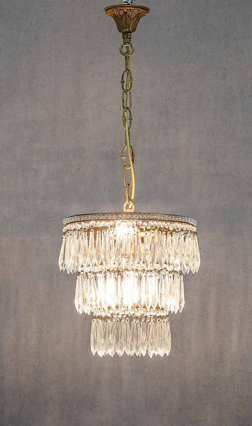 Petite three tier chandelier with elegant layered design for small interior spaces