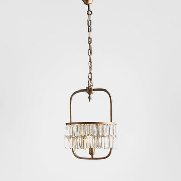 Toronto chandelier crafted from solid brass with curved gold cage design and adjustable chain for modern dining rooms and statement interiors
