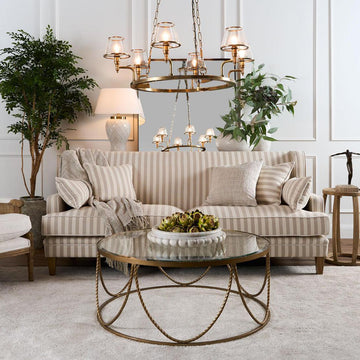 Elegant Sienna ceiling chandelier with antique brass finish and decorative glass shades for sophisticated interiors