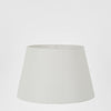 Small textured ivory linen taper lamp shade for bedside and table lamps with soft ambient lighting