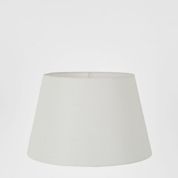 Small textured ivory linen taper lamp shade for bedside and table lamps with soft ambient lighting