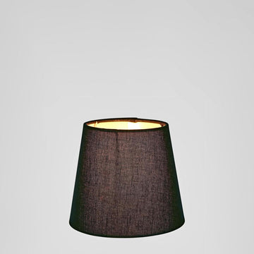 Small black fabric lamp shade in tapered shape for bedside lighting