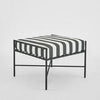 Sheffield outdoor ottoman with black and white striped cushion powder coated steel frame and weather resistant fabric for modern patio seating