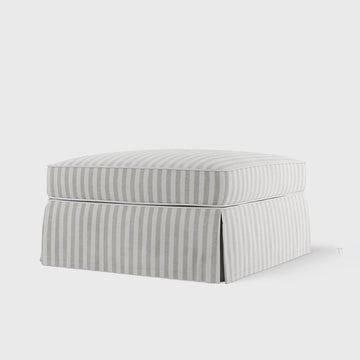 Luxury natural stripe upholstered ottoman with comfortable feather filled cushion for coastal inspired living spaces