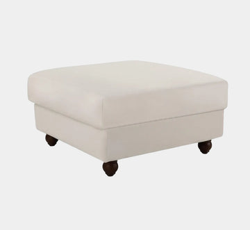 Hamptons style upholstered ottoman in pebble fabric with feather filled cushioning for relaxed coastal interiors