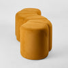 Contemporary ridge bench ottoman with soft velvet upholstery featuring a modern S-shaped design for
