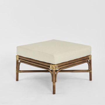 Handcrafted Dynasty rattan ottoman with white linen cushion and Chippendale style detailing for luxury coastal interiors