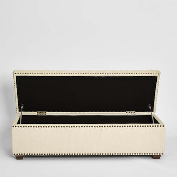 Luxury bedroom storage ottoman in beige fabric with tufted cushion top and hidden internal storage space
