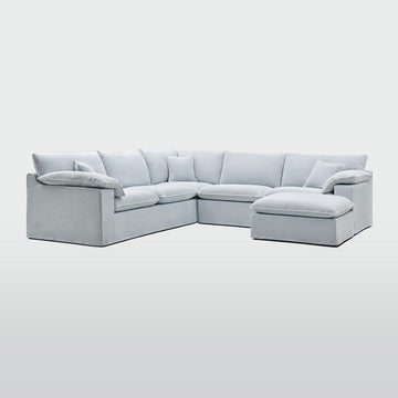 Coastal style upholstered ottoman in beach colour with white piping for modern modular living room seating