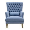 Bayside wingback armchair in slate blue fabric with button tufting, high backrest, and wooden legs