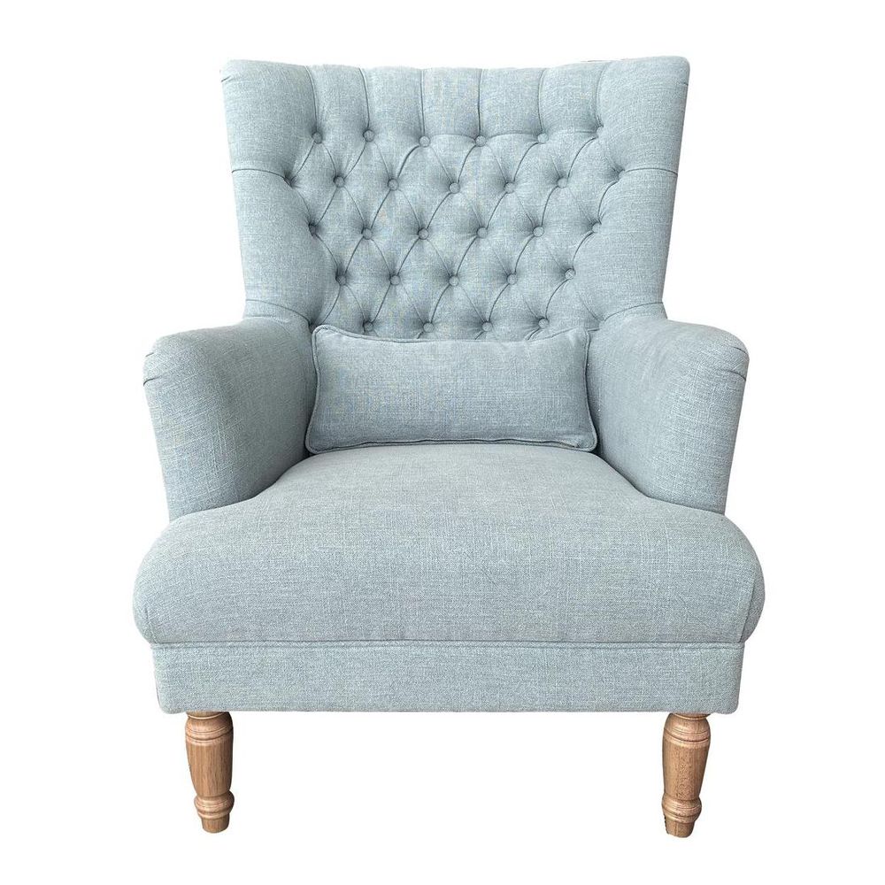 Pistachio green wingback armchair with button tufting, high back, and cushioned seating