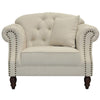 Vaucluse beige sofa with button tufted back, rolled arms, stud detailing, and turned wooden legs