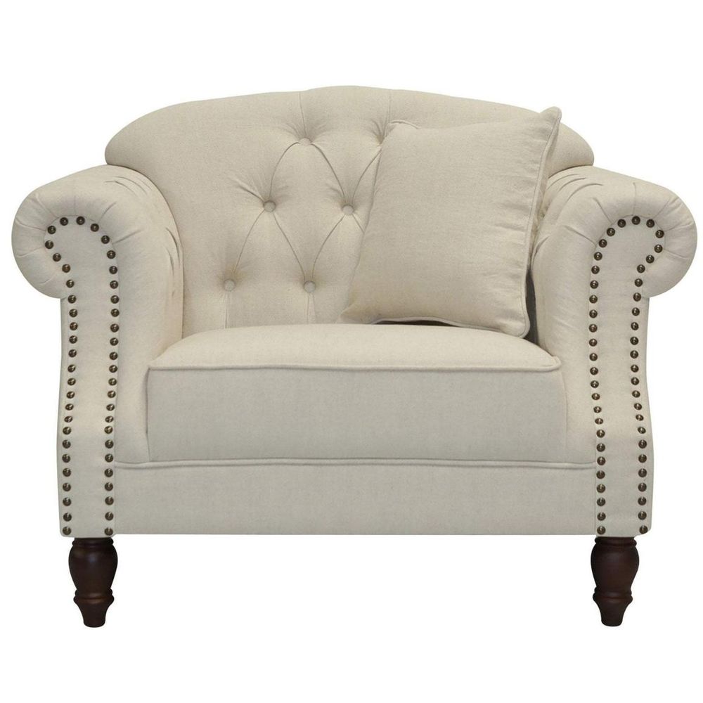 Vaucluse beige sofa with button tufted back, rolled arms, stud detailing, and turned wooden legs