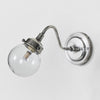 Beacon Outdoor Wall Lamp in antique silver with curved arm and glass globe – elegant outdoor wall sconce for entryways, patios, and verandas
