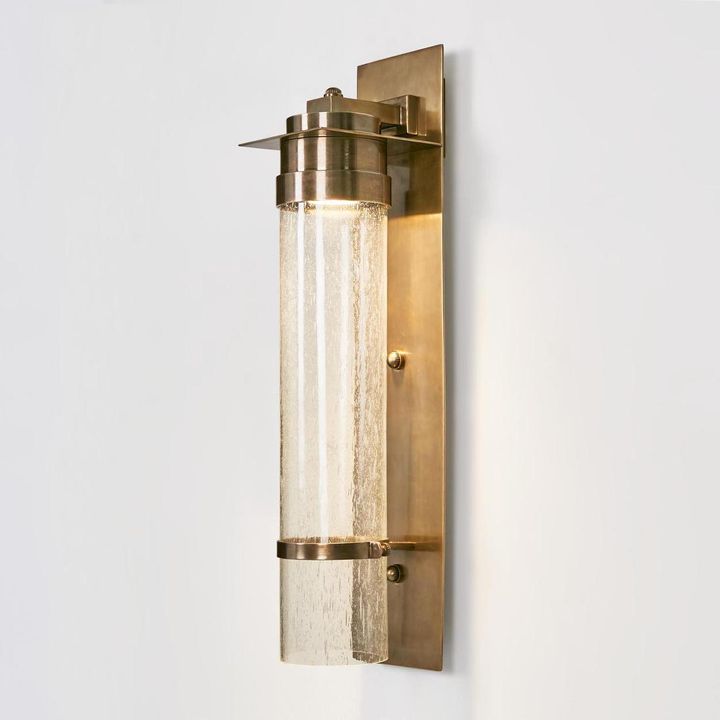 Sea Cottage Outdoor Wall Light in antique brass with cracked cylinder glass – coastal outdoor wall sconce for entryways, patios, and porches