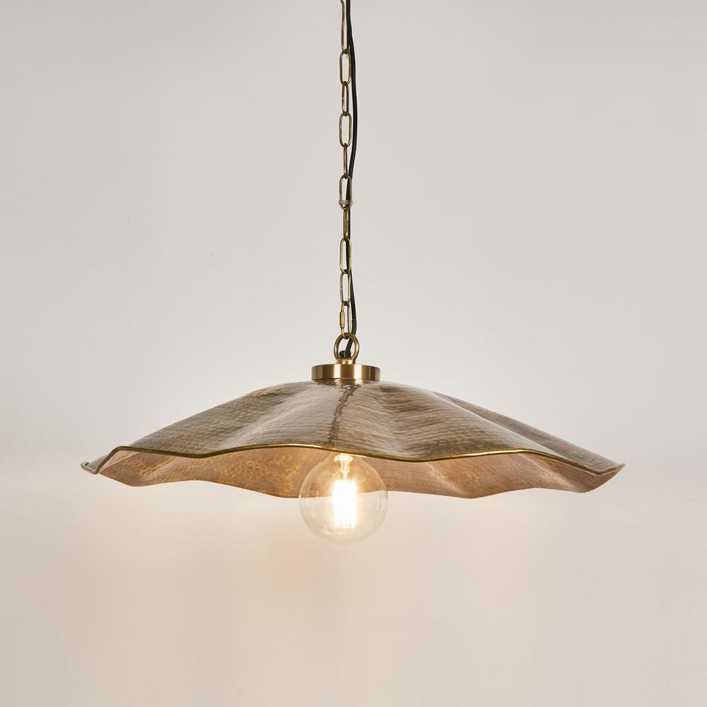 Melville ceiling pendant in antique brass with scalloped umbrella design, hammered metal pendant light for dining rooms, kitchen islands, and cafes