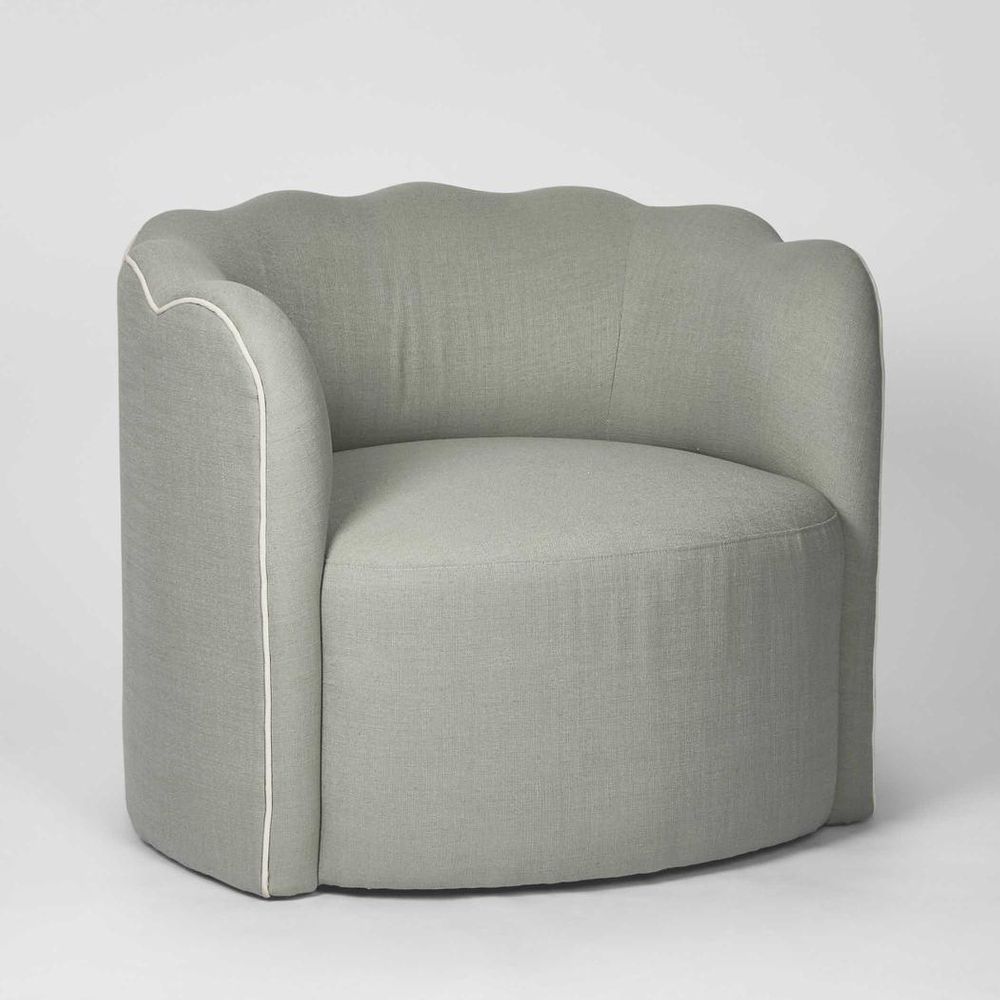 Scallop back accent chair in blue fabric designed for living rooms and reading nooks