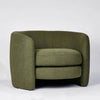 High-back curved armchair with boucle upholstery and modern design for living room or bedroom use