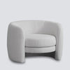 Cora curved armchair in vanilla boucle with high back circular design for modern living room seating