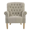 Natural linen buttoned armchair with rolled arms, tufted backrest, stud detailing, and solid oak legs