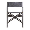 Jodhpur folding chair set with leather seat, black metal frame, and brass accents in modern industrial design