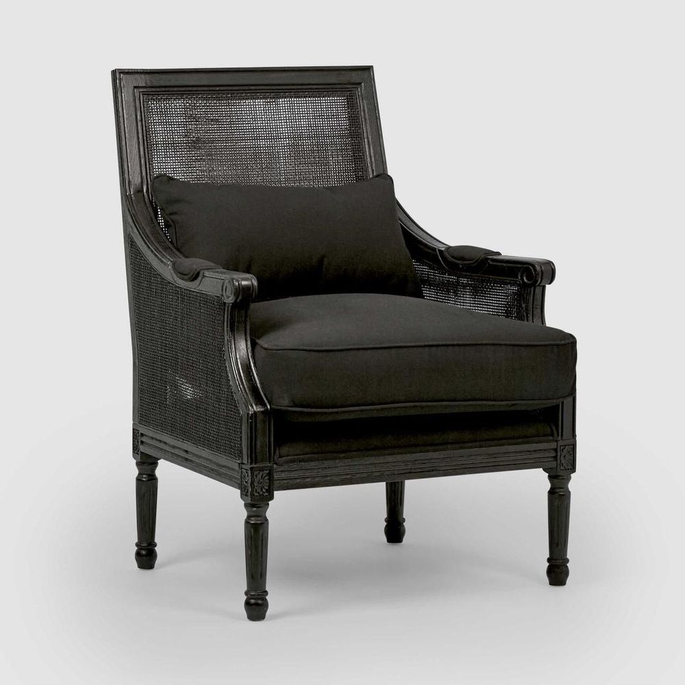 Hicks black armchair with hand carved solid oak frame, ornate detailing, and cushioned upholstered seat
