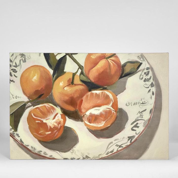 Peeled Oranges wall art featuring a vibrant peeled orange still life in rich orange tones against a soft neutral background, framed artwork 82.5 x 82.5 cm