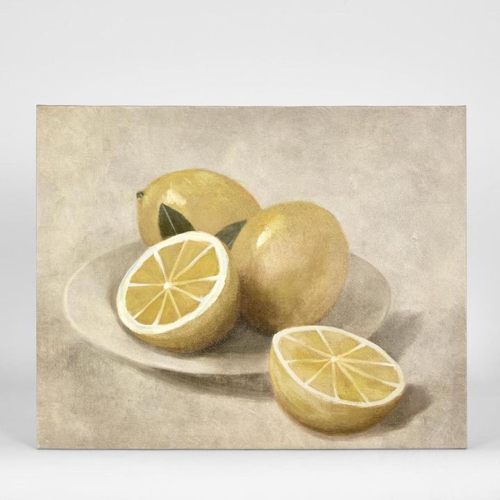 Lemons on White Plate wall art featuring a vibrant citrus still life with lemons on a white plate in bright tones, framed artwork 40 x 50 cm