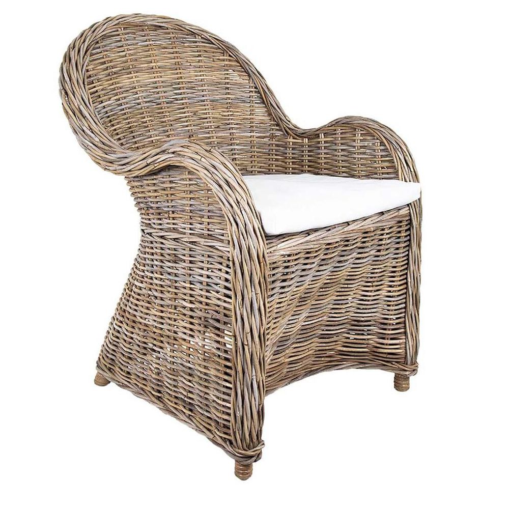Long Island wicker armchair with handwoven rattan frame, rolled arms, and removable cushion in coastal Hamptons style