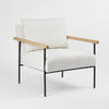 Liam modern armchair with metal base wooden arm detail and neutral upholstered seat with pillow backrest