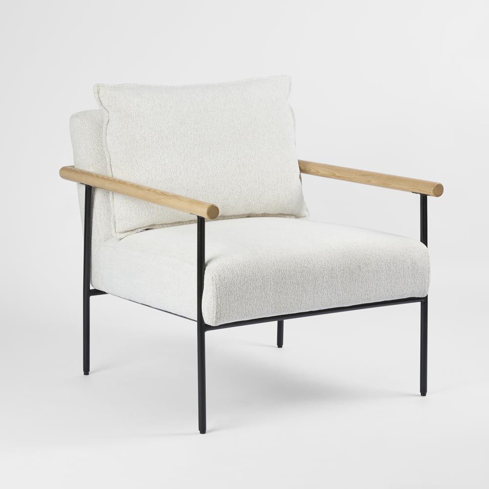 Liam modern armchair with metal base wooden arm detail and neutral upholstered seat with pillow backrest