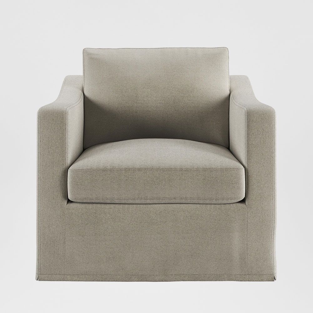 Hamptons slipcover armchair upholstered accent chair with feather cushions, rolled arms, and removable fabric cover in elegant living room