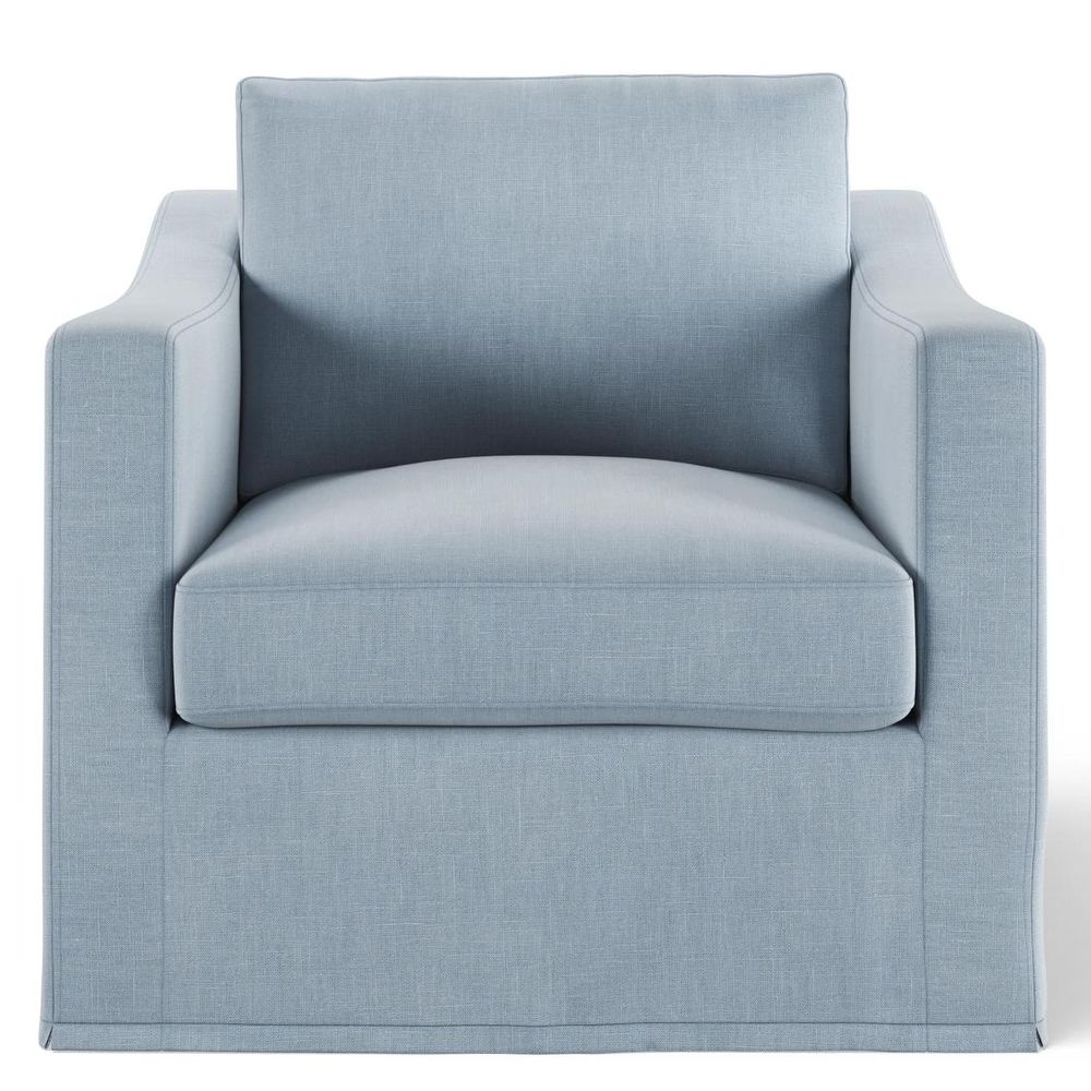 Classic Hamptons style slipcover armchair featuring feather-filled cushions, tailored piping, and relaxed upholstered seating