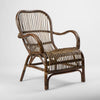 Artisan wicker style armchair with curved silhouette and comfortable seating design