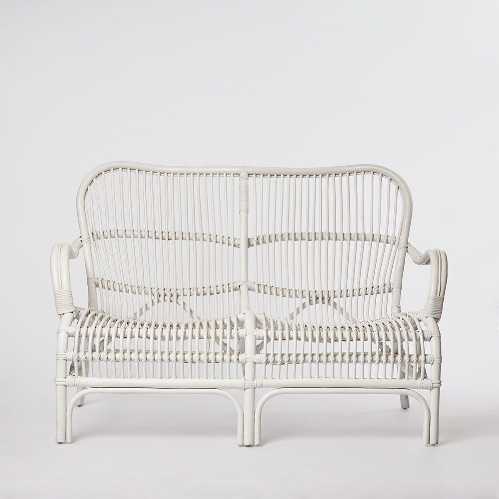 Seville hand woven rattan armchair with high backrest and curved contemporary design for indoor seating
