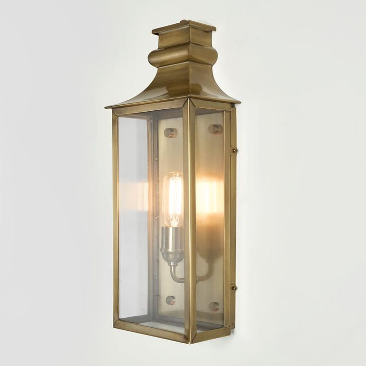 Westpoint Outdoor Wall Light solid brass with clear glass panels and antique brass finish – timeless outdoor wall sconce for entryways, hallways, patios, and exterior walls