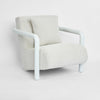 Weather-resistant outdoor armchair with minimalist design and comfortable cushions for outdoor spaces