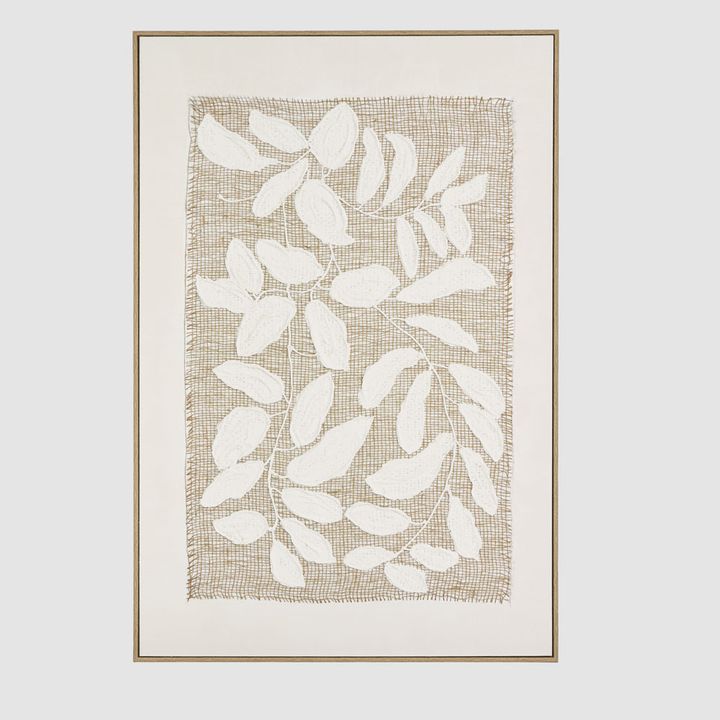 Linen Botanica wall art featuring white hand-sculpted leaves on a woven natural linen backdrop.