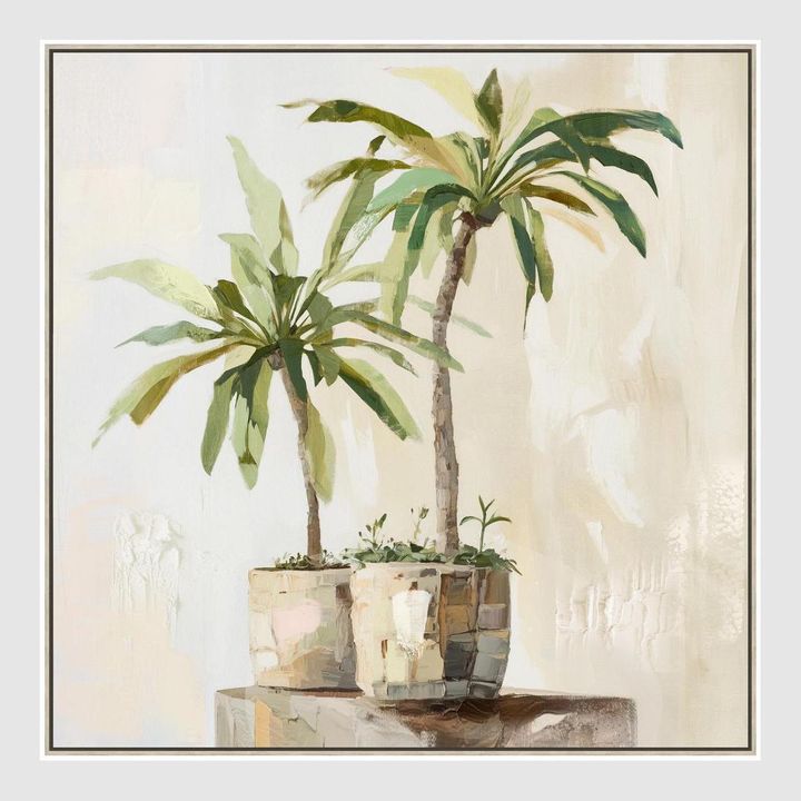Sunlit Palms wall art featuring sculptural potted palm leaves in soft green and neutral tones, large framed botanical artwork 82.5 x 82.5 cm