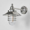 Clark Wall Light IP54 solid brass with clear glass and metal cage – industrial outdoor wall sconce for patios, entryways, gardens, and bathroom mirror lighting