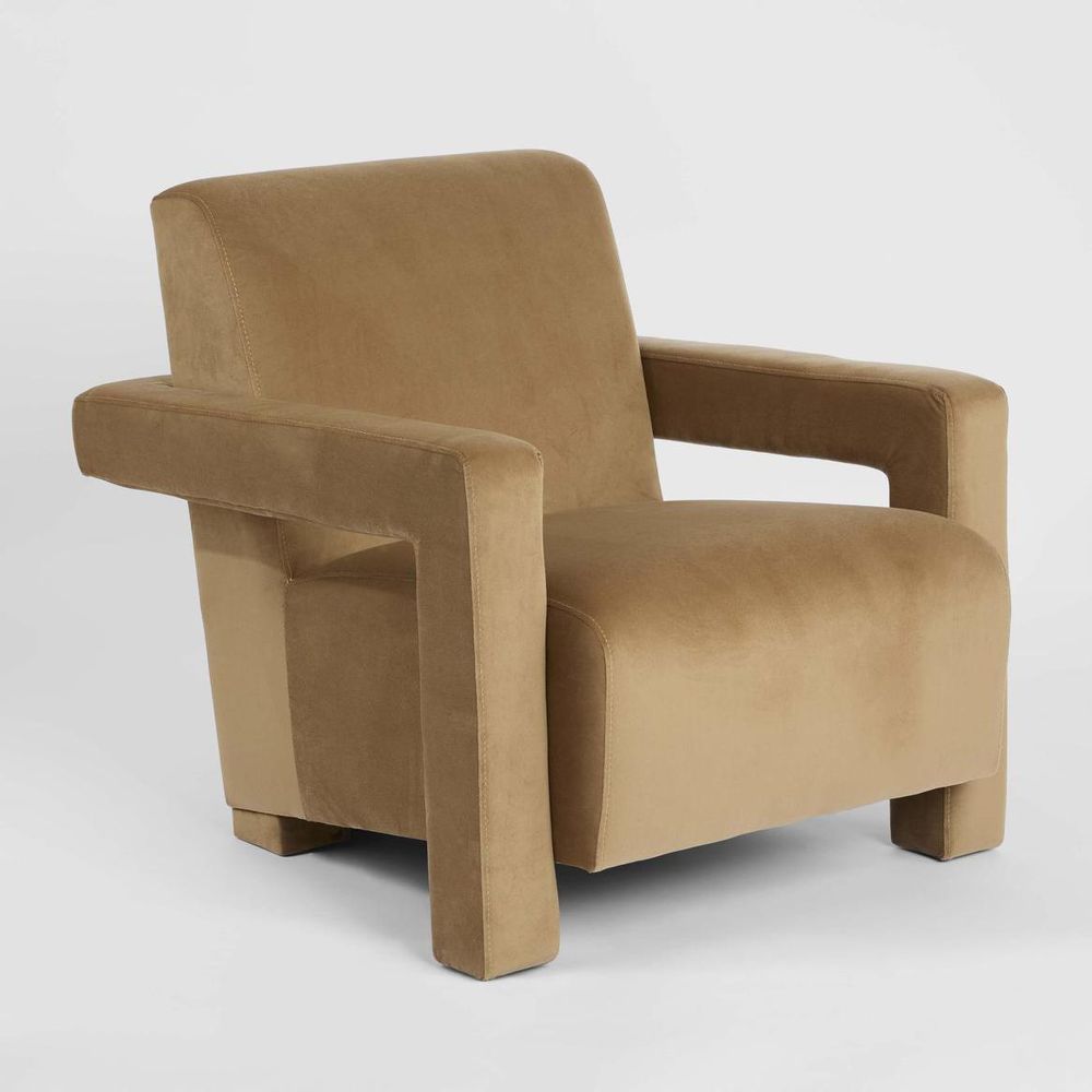 Sculptural modern armchair with bold lines and deep seat for contemporary living room seating