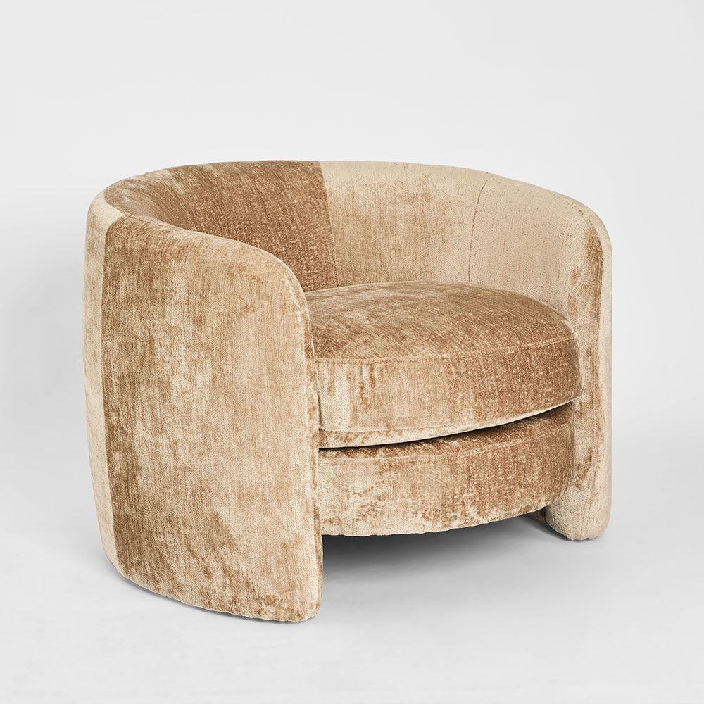 Modern Cora armchair with curved enclosed armrests and high backrest for contemporary interiors