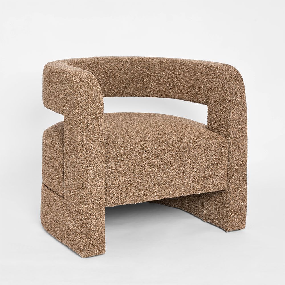 Modern Cleo curved armchair with enclosed armrests and cushioned upholstery for contemporary interiors