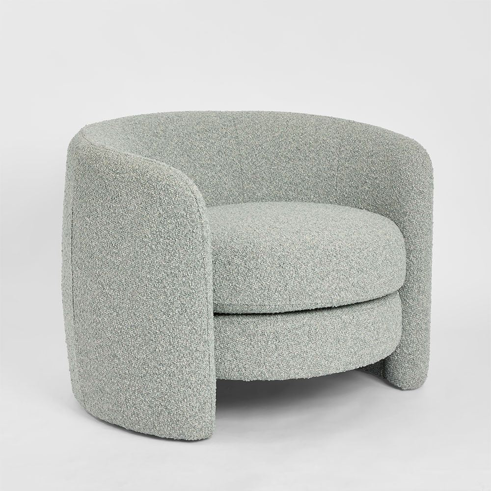 Cora curved armchair with high back circular design and upholstered seat for modern living room seating