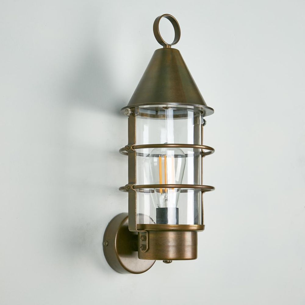 Eastwood Wall Light IP54 solid brass with clear glass and metal cage – vintage industrial outdoor wall sconce for patios, entryways, and bathrooms