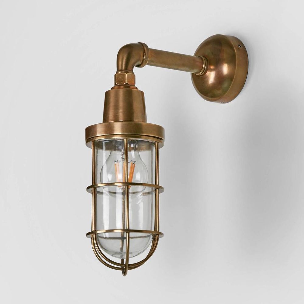 Starboard Wall Light IP54 solid brass with clear handmade glass and metal cage – industrial outdoor wall sconce for patios, entryways, bathrooms, and garden lighting