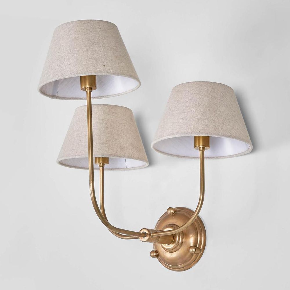 Trilogy Wall Lamp Victorian three-arm wall light in antique brass or silver – traditional candle-style sconce with cream sleeves for heritage interiors