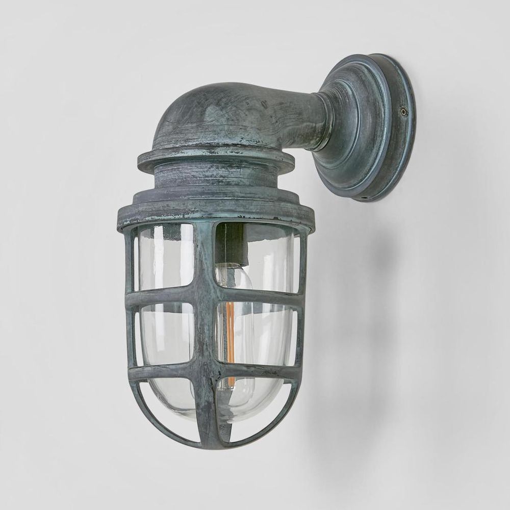 Porto wall light with clear glass and solid brass cage, IP54 weather-rated wall sconce for indoor or outdoor use in industrial, rustic, or coastal décor
