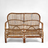 Seville rattan armchair with hand woven frame, high back design, and curved silhouette for indoor or sheltered outdoor use