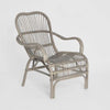 Seville hand woven rattan armchair with high backrest, curved silhouette, and natural finish for indoor seating